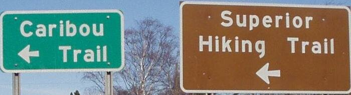 Traveling northeast on Hwy 61, 4 miles past Tofte, turn left at these signs.