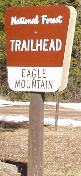 National Forest sign, turn left into trail head parking lot.