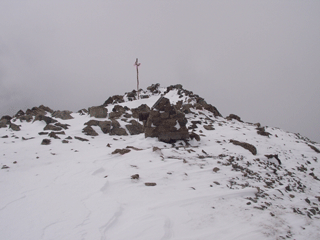 Cairn-shelter on the summit, drifted full of snow.